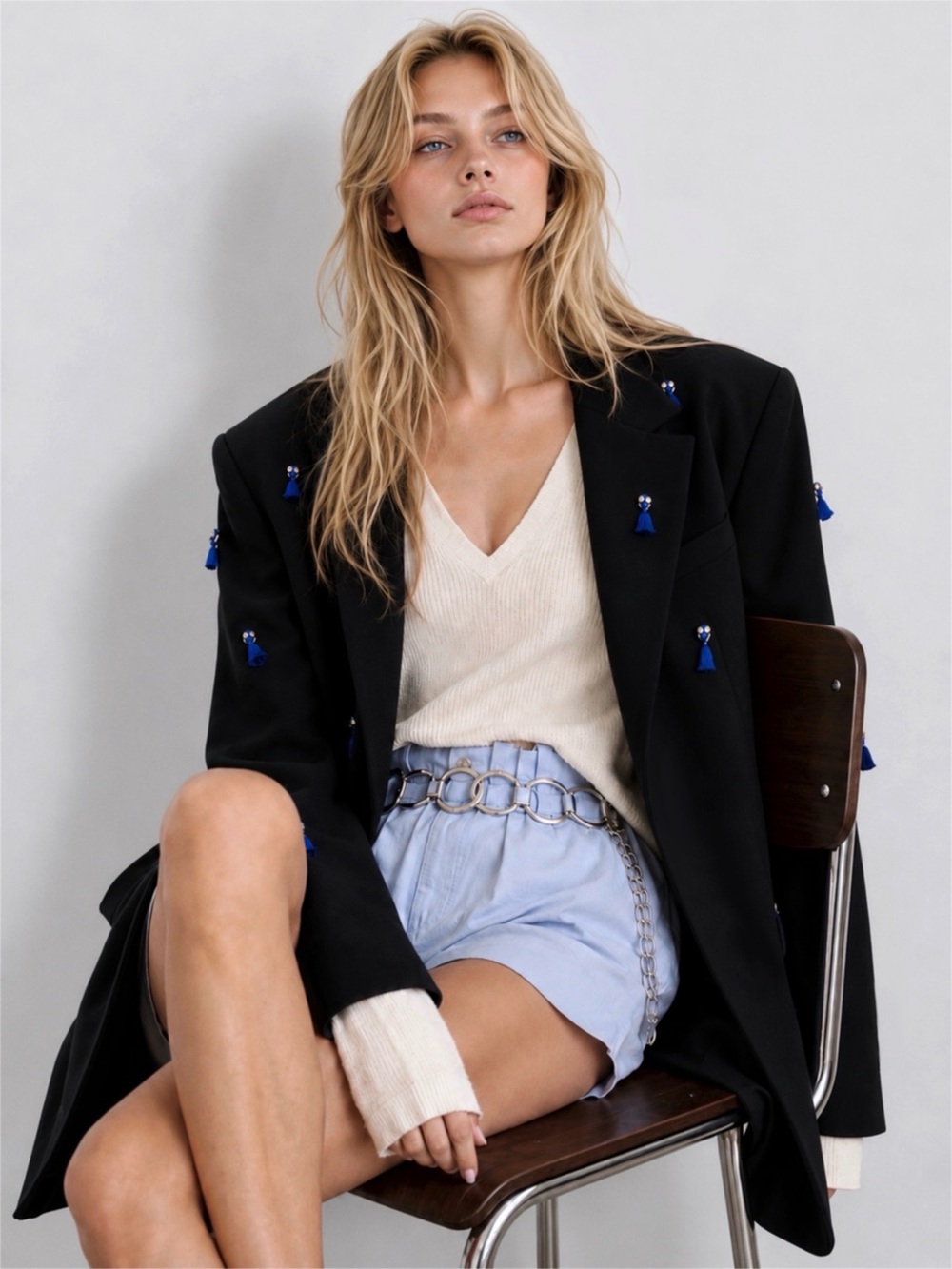 Black embellished blazer with blue tassel